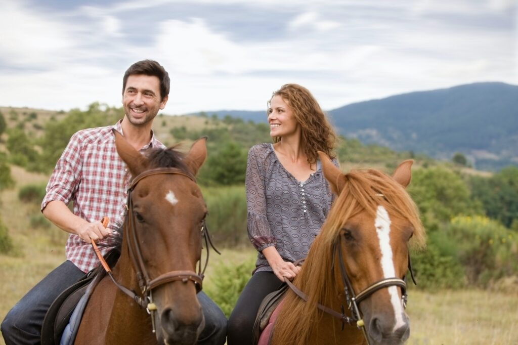 Couple riding horses